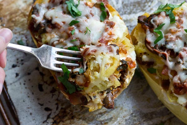 These Vegetarian Lasagna Spaghetti Squash Boats will rock your world. It's super filling and each boast is packed with several cups of mushrooms, onions, and spinach! Talk about veggie-fied. You're going to love this lower carb and meatless take on lasagna that will satisfy that pasta craving.