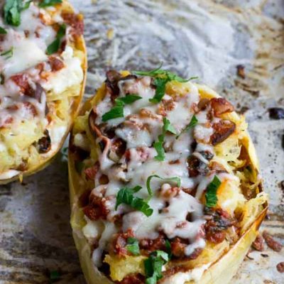 These Vegetarian Lasagna Spaghetti Squash Boats will rock your world. It's super filling and each boast is packed with several cups of mushrooms, onions, and spinach! Talk about veggie-fied. You're going to love this lower carb and meatless take on lasagna that will satisfy that pasta craving.