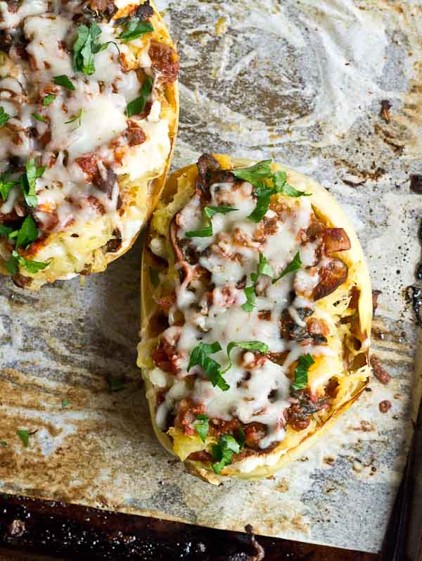 These Vegetarian Lasagna Spaghetti Squash Boats will rock your world. It's super filling and each boat is packed with several cups of mushrooms, onions, and spinach! Talk about veggie-fied. You're going to love this lower carb and meatless take on lasagna that will satisfy that pasta craving.