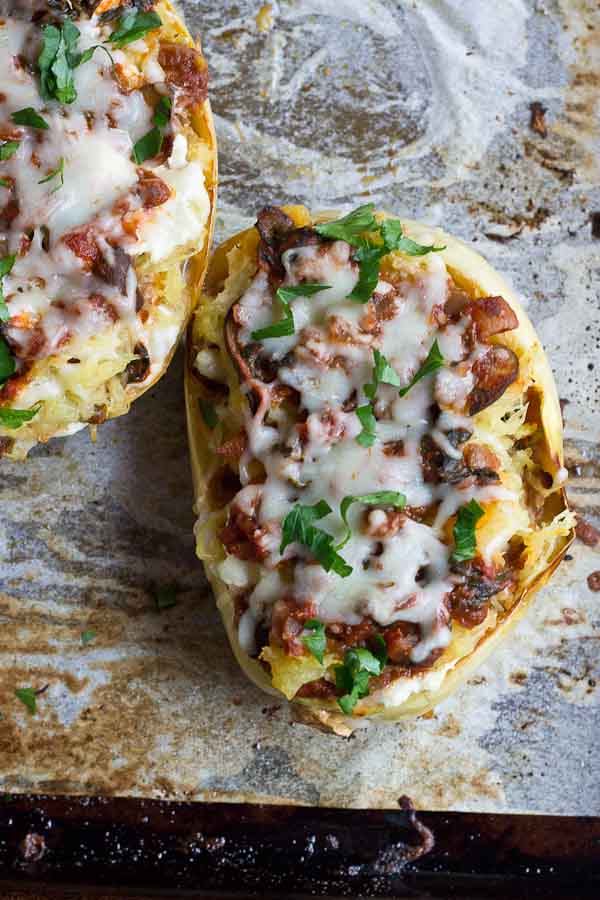 These Vegetarian Lasagna Spaghetti Squash Boats will rock your world. It's super filling and each boat is packed with several cups of mushrooms, onions, and spinach! Talk about veggie-fied. You're going to love this lower carb and meatless take on lasagna that will satisfy that pasta craving.