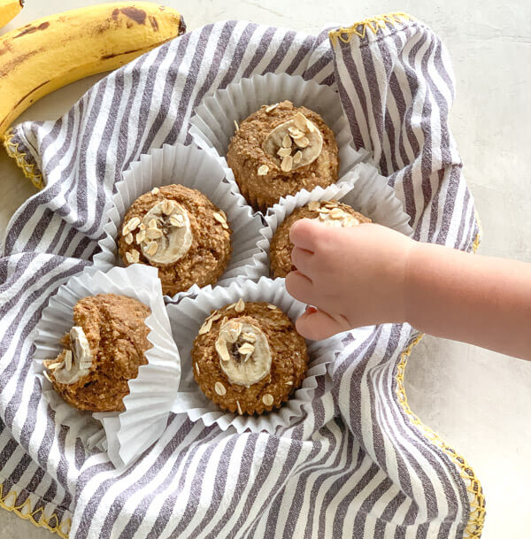 These Banana Oatmeal Muffins are moist, healthy and oil free applesauce muffins with a delicious cinnamon banana flavor. Easy gluten free muffins made with oat flour!