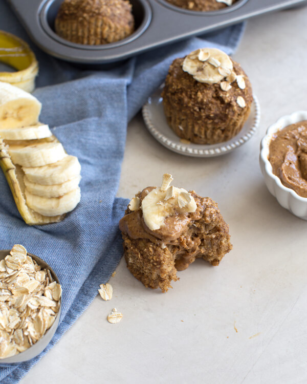 These Banana Oatmeal Muffins are moist, healthy and oil free applesauce muffins with a delicious cinnamon banana flavor. Easy gluten free muffins made with oat flour!