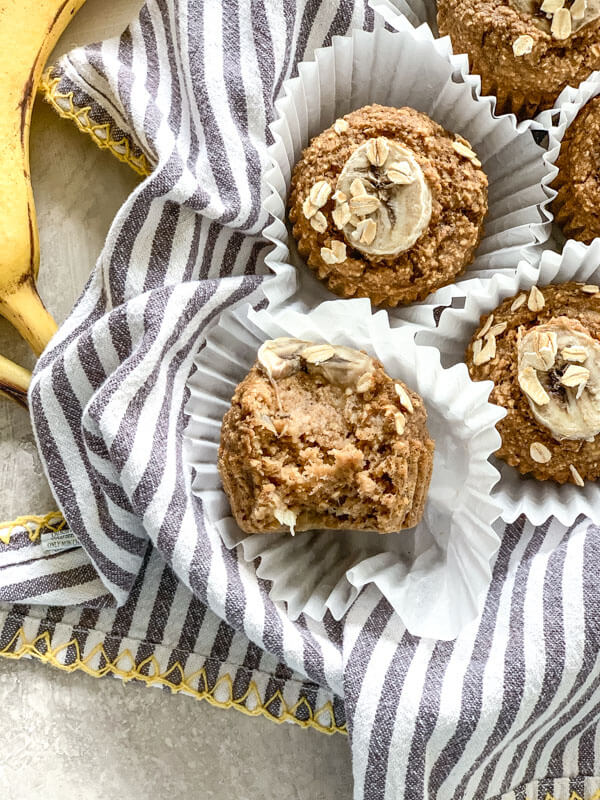 These Banana Oatmeal Muffins are moist, healthy and oil free applesauce muffins with a delicious cinnamon banana flavor. Easy gluten free muffins made with oat flour!