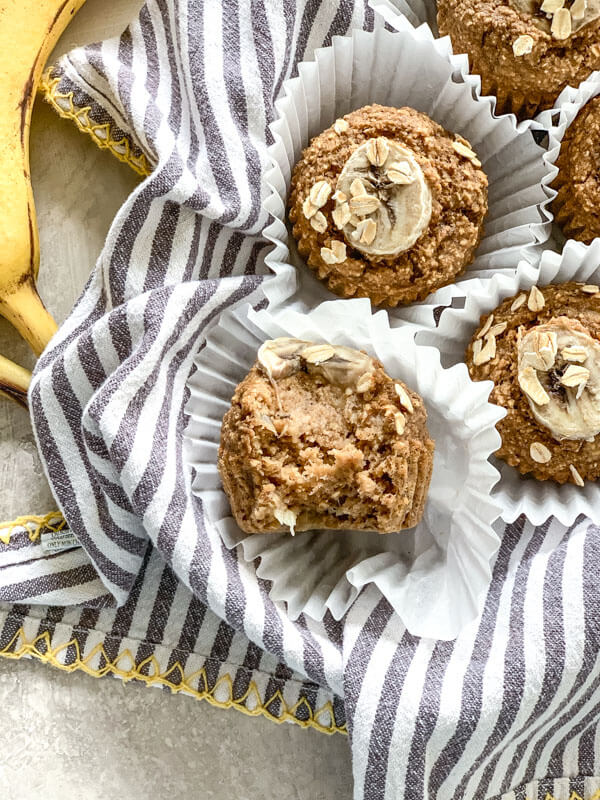 These Banana Oatmeal Muffins are moist, healthy and oil free applesauce muffins with a delicious cinnamon banana flavor. Easy gluten free muffins made with oat flour!
