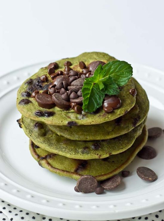 Start your morning with these Mint Chocolate Chip Blender Pancakes! These taste like Mint Chocolate Chip ice cream but in pancake form. Get your green pancake on just in time for St Patty's Day! Whole wheat, dye and coloring free, dark chocolate, and a hidden source of veggies for breakfast. 