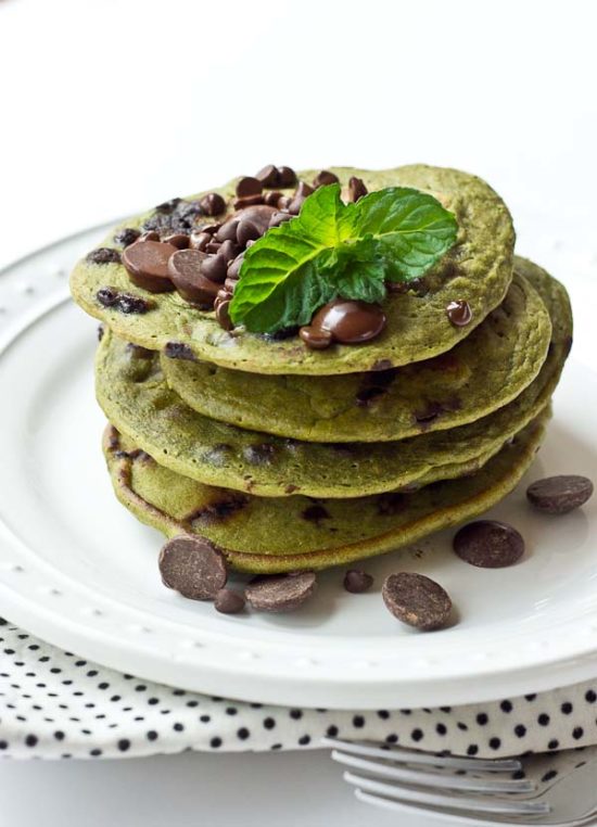 Start your morning with these Mint Chocolate Chip Blender Pancakes! These taste like Mint Chocolate Chip ice cream but in pancake form. Get your green pancake on just in time for St Patty's Day! Whole wheat, dye and coloring free, dark chocolate, and a hidden source of veggies for breakfast. 