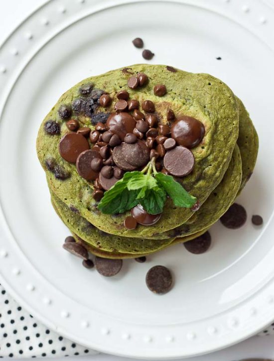 Start your morning with these Mint Chocolate Chip Blender Pancakes! These taste like Mint Chocolate Chip ice cream but in pancake form. Get your green pancake on just in time for St Patty's Day! Whole wheat, dye and coloring free, dark chocolate, and a hidden source of veggies for breakfast. 