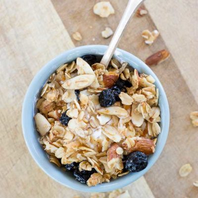 Blueberry Muffin Granola tastes like a warm coffee shop-like blueberry muffin, with a healthy twist of course; no refined sugar or flour here. The best part is that comforting smell of homemade blueberry muffins fills the house while the granola bakes!