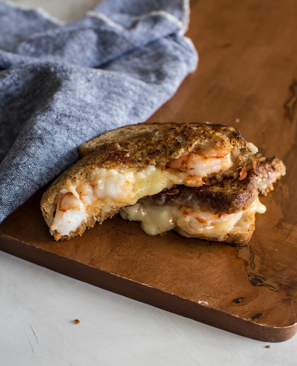 This Shrimp Grilled Cheese doesn't hold anything back-- melted cheddar cheese, buttered toast, and large grilled shrimp. Let loose, unwind and savor this comfort food any night of the week.