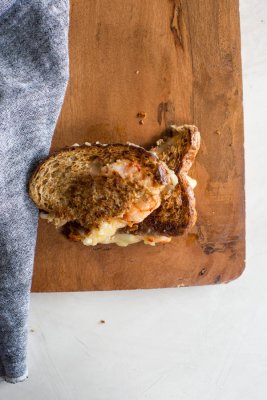 This Shrimp Grilled Cheese doesn't hold anything back-- melted cheddar cheese, buttered toast, and large grilled shrimp. Let loose, unwind and savor this comfort food any night of the week. 