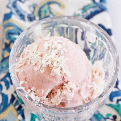 This Strawberry Coconut Ice Cream is so decadent and lusciously creamy! Grab a bowl of this vegan ice cream made with less refined sugar thanks to the sweetness of fresh strawberries and bananas.
