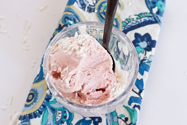 This Strawberry Coconut Ice Cream is so decadent and lusciously creamy! Grab a bowl of this vegan ice cream made with less refined sugar thanks to the sweetness of fresh strawberries and bananas.