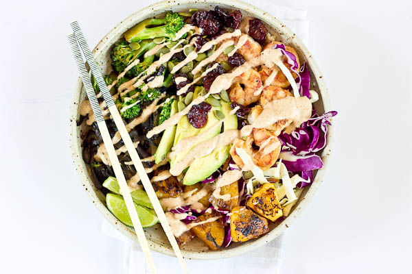 This Tropical Buddha Bowl is infused with island flavor from the Coconut Brown Rice to the Almond Butter Lime dressing. Perfectly grilled shrimp, pineapple, tart cherries, and a bowl full of veggies! It’s great for meal prep.