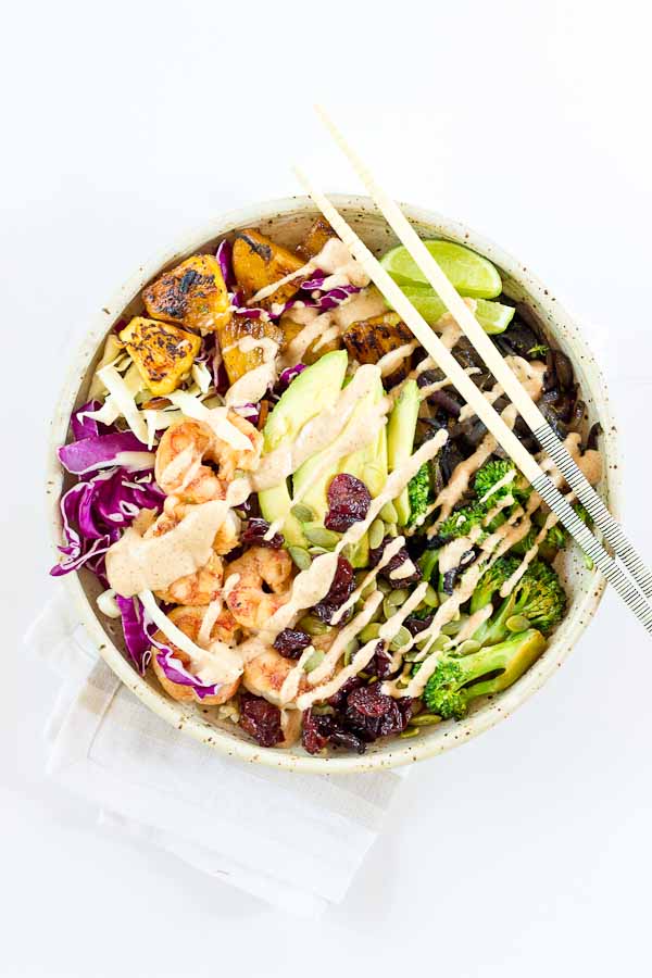 This Tropical Buddha Bowl is infused with island flavor from the Coconut Brown Rice to the Almond Butter Lime dressing. Perfectly grilled shrimp, pineapple, tart cherries, and a bowl full of veggies! It’s great for meal prep.