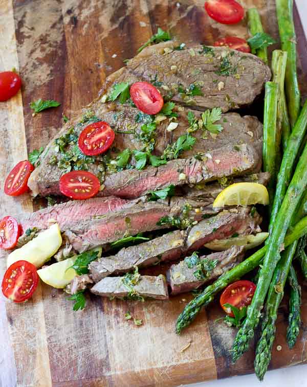 Grilled Top Sirloin Filets with Italian Salsa Verde.... this protein is all about the flavor. The bursts of lemon garlic in this sauce on top of grilled top sirloin is outrageously good and enhances the flavor of the beef.