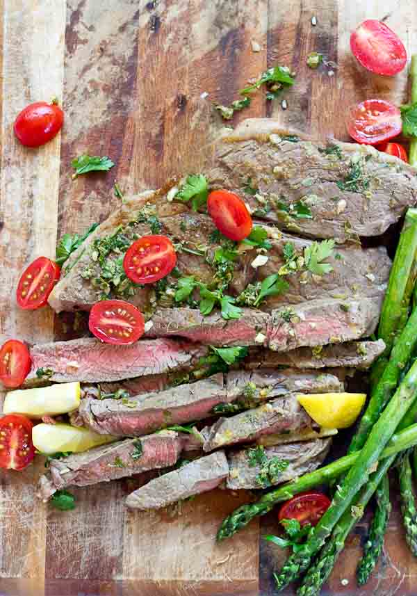 Grilled Top Sirloin Filets with Italian Salsa Verde.... this protein is all about the flavor. The bursts of lemon garlic in this sauce on top of grilled top sirloin is outrageously good and enhances the flavor of the beef.