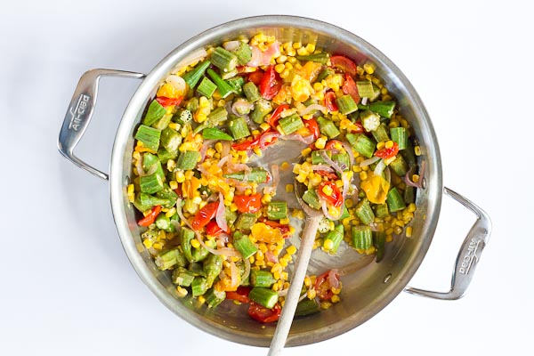 Okra Succotash, a simple sauté of fresh okra, corn, tomatoes, and onions, is a yummmmm side dish for your next cookout... just in time for Memorial Day! I love this side because it's fresh and filled with seasonal veggies that will make you feel good on a hot sunny day. 