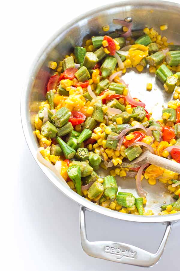 Okra Succotash, a simple sauté of fresh okra, corn, tomatoes, and onions, is a yummmmm side dish for your next cookout... just in time for Memorial Day! I love this side because it's fresh and filled with seasonal veggies that will make you feel good on a hot sunny day. 