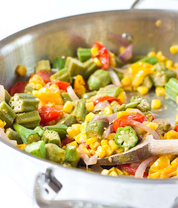 Okra Succotash, a simple sauté of fresh okra, corn, tomatoes, and onions, is a yummmmm side dish for your next cookout... just in time for Memorial Day! I love this side because it's fresh and filled with seasonal veggies that will make you feel good on a hot sunny day. 