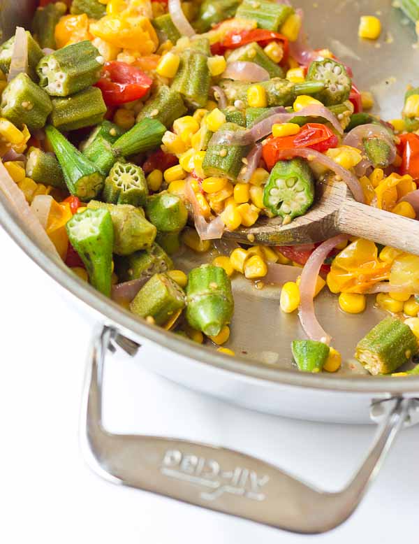 Okra Succotash, a simple sauté of fresh okra, corn, tomatoes, and onions, is a yummmmm side dish for your next cookout... just in time for Memorial Day! I love this side because it's fresh and filled with seasonal veggies that will make you feel good on a hot sunny day. 