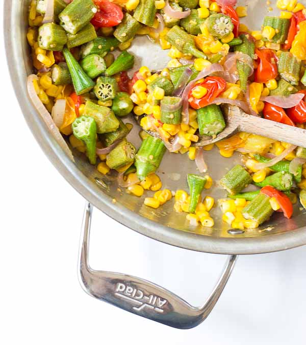 Okra Succotash, a simple sauté of fresh okra, corn, tomatoes, and onions, is a yummmmm side dish for your next cookout... just in time for Memorial Day! I love this side because it's fresh and filled with seasonal veggies that will make you feel good on a hot sunny day. 