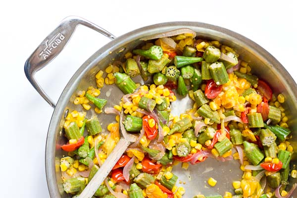 Okra Succotash, a simple sauté of fresh okra, corn, tomatoes, and onions, is a yummmmm side dish for your next cookout... just in time for Memorial Day! I love this side because it's fresh and filled with seasonal veggies that will make you feel good on a hot sunny day. 