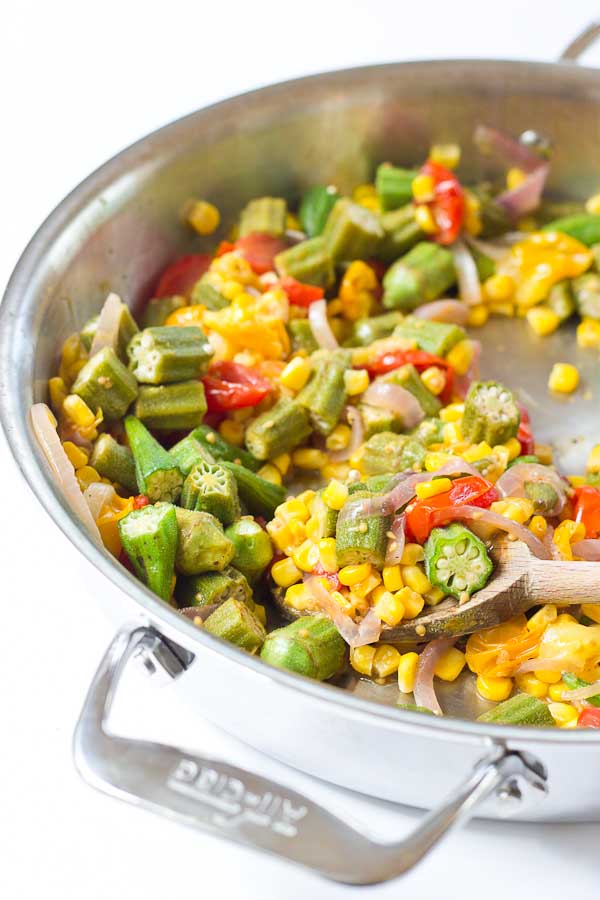 Okra Succotash, a simple sauté of fresh okra, corn, tomatoes, and onions, is a yummmmm side dish for your next cookout... just in time for Memorial Day! I love this side because it's fresh and filled with seasonal veggies that will make you feel good on a hot sunny day. 