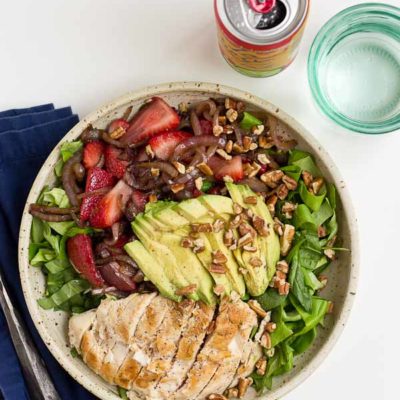 This Strawberry Balsamic Grilled Chicken Salad is light, crisp and perfect for summertime eating. The warm chicken and balsamic strawberries and onions add so much flavor to this salad. You're' going to love it!