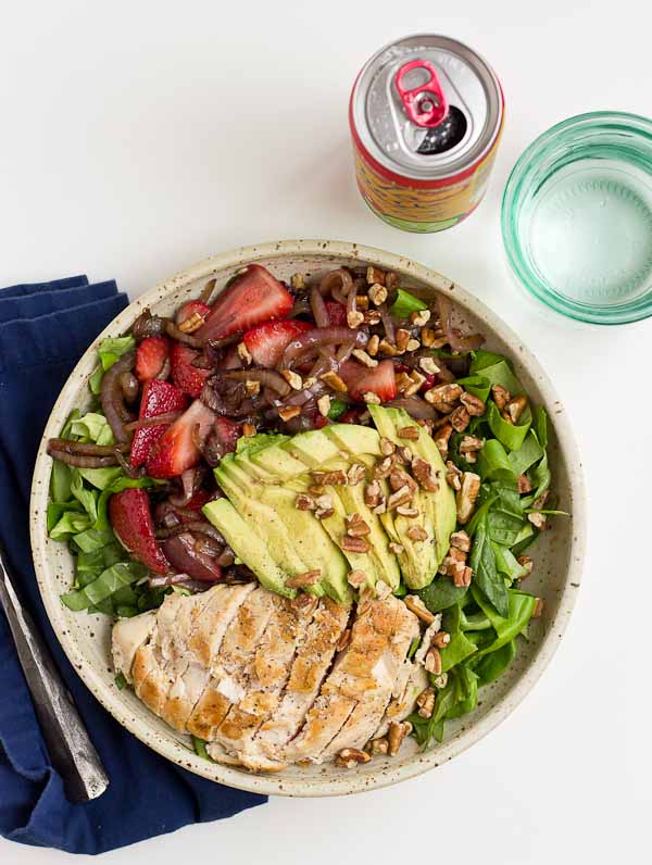 This Strawberry Balsamic Grilled Chicken Salad is light, crisp and perfect for summertime eating. The warm chicken and balsamic strawberries and onions add so much flavor to this salad. You're' going to love it!