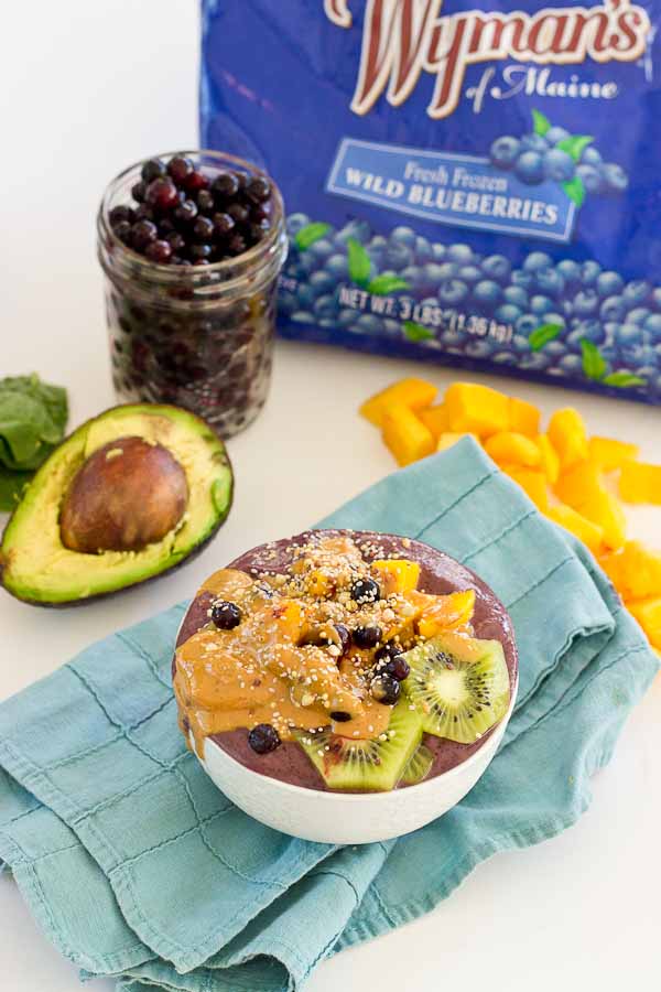 With summer quickly approaching, this superfood smoothie bowl will keep you cool and fueled on the sunniest days. Wild blueberries, spinach, avocado, and flaxmilk combine to form a creamy, antioxidant-packed bowl that is vegan and gluten-free! Slices of fresh kiwi and a drizzle of almond butter make this smoothie bowl practically irresistible.