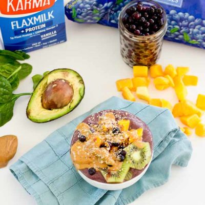 With summer quickly approaching, this superfood smoothie bowl will keep you cool and fueled on the sunniest days. Wild blueberries, spinach, avocado, and flaxmilk combine to form a creamy, antioxidant-packed bowl that is vegan and gluten-free! Slices of fresh kiwi and a drizzle of almond butter make this smoothie bowl practically irresistible.