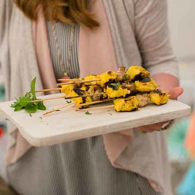 These Tandoori Chicken Skewers are juicy, moist and full of that bold Indian flavor. The chicken is marinated in Greek yogurt and curry spices and grilled to perfection. Serve right of the grill with warm garlicky naan bread.