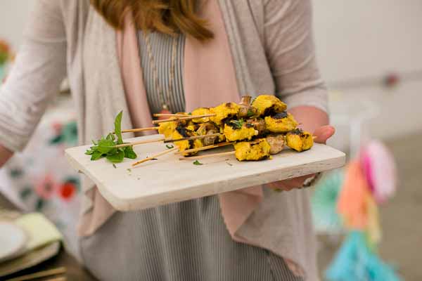  These Tandoori Chicken Skewers are juicy, moist and full of that bold Indian flavor. The chicken is marinated in Greek yogurt, lemon, and turmeric and grilled to perfection. Serve right off the grill with warm garlicky naan bread.