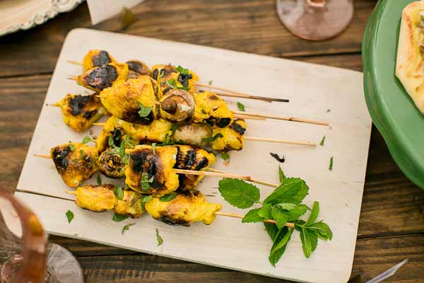  These Tandoori Chicken Skewers are juicy, moist and full of that bold Indian flavor. The chicken is marinated in Greek yogurt, lemon, and turmeric and grilled to perfection. Serve right off the grill with warm garlicky naan bread.