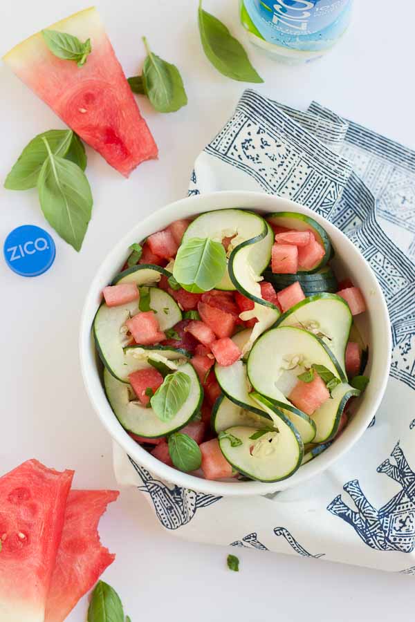 This Watermelon Cucumber Salad is all about fresh summer produce and just 5 ingredients. Watermelon, cucumber, basil and coconut water will hydrate and make you feel refreshed from the inside out. 