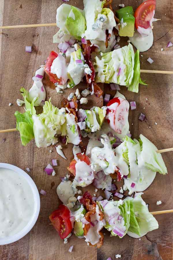 Wedge Salad Skewers…. Iceberg lettuce, crispy bacon, avocado, tomatoes, and blue cheese dressing on a stick. YUM!! This appetizer is perfect at a cookout or anytime you’re serving a crowd. 