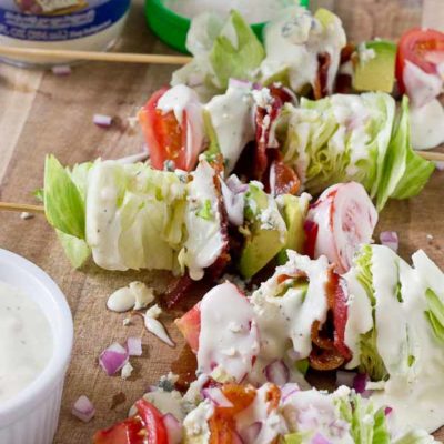 Wedge Salad Skewers…. Iceberg lettuce, crispy bacon, avocado, tomatoes, and blue cheese dressing on a stick. YUM!! This appetizer is perfect at a cookout or anytime you’re serving a crowd.