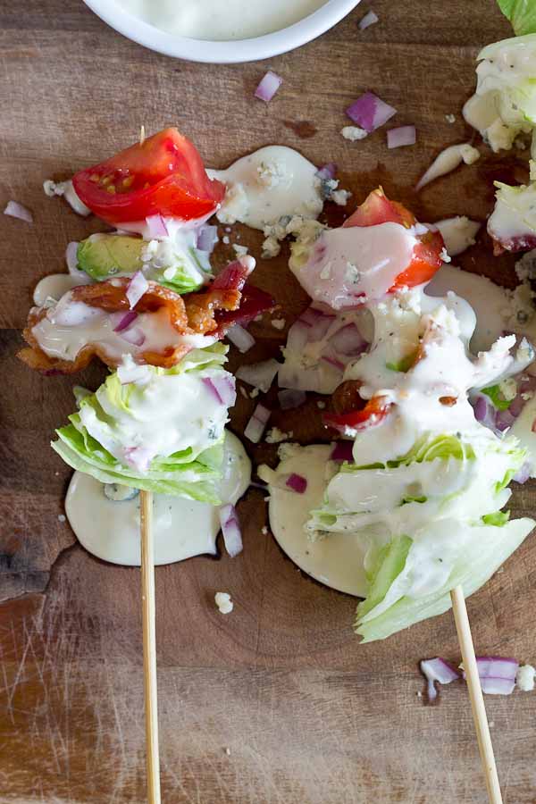 Wedge Salad Skewers…. Iceberg lettuce, crispy bacon, avocado, tomatoes, and blue cheese dressing on a stick. YUM!! This appetizer is perfect at a cookout or anytime you’re serving a crowd. 