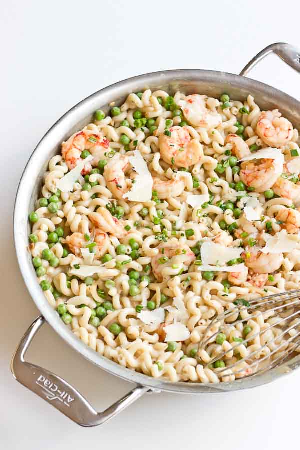  Your favorite food as a kid just grew up... peas, shallots, wild red shrimp, gruyere and cheddar cheese. Get a bowl of this Shrimp Mac n Cheese ASAP! Happy hump day friends. It's mid July... but I really can't believe the summer is almost over. So much so that I've started to see some pumpkin recipes floating around the web. I know, I know, for you summer purists, how dare I say the word pumpkin in July. Hey, I'm just calling it like it is, I haven't started making anything pumpkin yet, but the glorious fall is just around the corner. I've already started talking about how wonderful it will be :) But first we are headed to the beach this weekend for a big family friendly weekend with all the LaRues. I'm looking forward to a little getaway and spending the weekend relaxing with the fam, and all of the new babies. Last year at the beach 3 of us were preggers and this year we have babies ranging 7-13 months + a 4 year old. This year is going to be so different and probably less relaxing. With 3 baby sleep schedules all under one roof... AHHH. Anyone have any tips for traveling with a 9 month old? It's only a two hour drive but I want to made the house as comfy as possible. We really haven't traveled much with him, since he was a baby baby. 