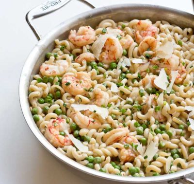 Your favorite food as a kid just grew up... peas, shallots, wild red shrimp, gruyere and cheddar cheese. get a bowl of this Shrimp Mac n Cheese ASAP!