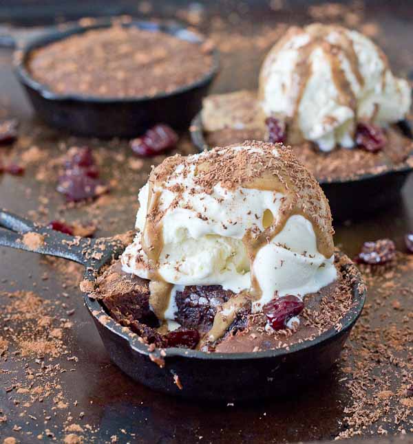 To get this healthy decadent perfect Double Chocolate Cherry Skillet Brownie.. this is what went down in my kitchen, aside from a BIG multi day mess. I made this recipe with 100% almond butter, 100% coconut oil, a mixture of AB and coconut oil, honey only, varying amounts of brown sugar, no flour, buckwheat flour, white whole wheat flour, with coffee and without, different oven temperatures, whipping the eggs first verses stirring them in later, 1-2-3 eggs, more chocolate and less chocolate. Don’t worry, we went with more chocolate.