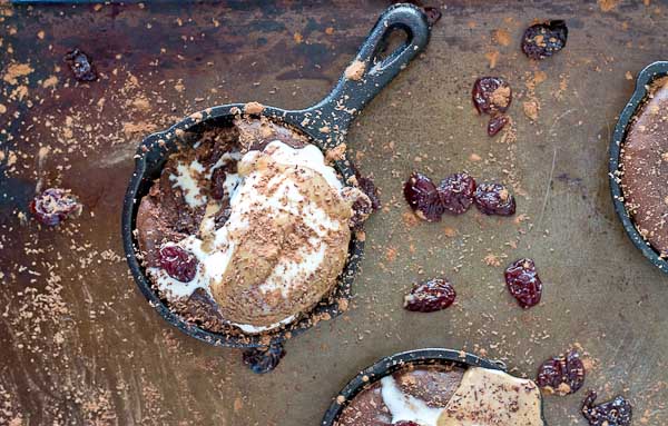 To get this healthy decadent perfect Double Chocolate Cherry Skillet Brownie.. this is what went down in my kitchen, aside from a BIG multi day mess. I made this recipe with 100% almond butter, 100% coconut oil, a mixture of AB and coconut oil, honey only, varying amounts of brown sugar, no flour, buckwheat flour, white whole wheat flour, with coffee and without, different oven temperatures, whipping the eggs first verses stirring them in later, 1-2-3 eggs, more chocolate and less chocolate. Don’t worry, we went with more chocolate.