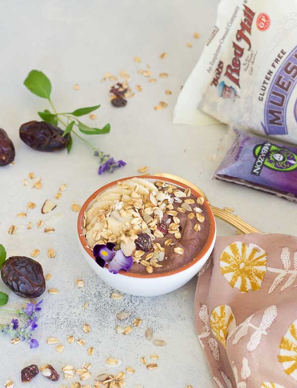 This Banana Peanut Butter Breakfast Bowl is seriously the best smoothie bowl ever. It's naturally sweetened with medjool dates, bananas and power packed with antioxidants from unsweetened acai. The creaminess factor was upped with plain kefir and peanut butter and topped with bananas (naturally) and gluten free muesli for irresistible crunch in every bite. 