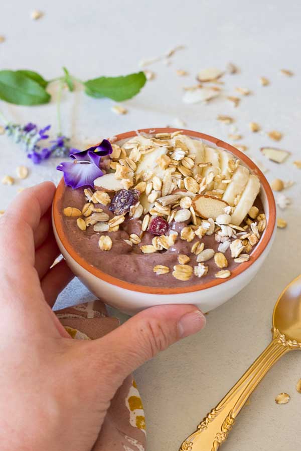 This Banana Peanut Butter Breakfast Bowl is seriously the best smoothie bowl ever. It's naturally sweetened with medjool dates, bananas and power packed with antioxidants from unsweetened acai. The creaminess factor was upped with plain kefir and peanut butter and topped with bananas (naturally) and gluten free muesli for irresistible crunch in every bite. 