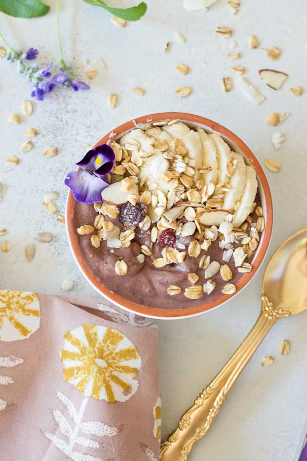 This Banana Peanut Butter Breakfast Bowl is seriously the best smoothie bowl ever. It's naturally sweetened with medjool dates, bananas and power packed with antioxidants from unsweetened acai. The creaminess factor was upped with plain kefir and peanut butter and topped with bananas (naturally) and gluten free muesli for irresistible crunch in every bite. 
