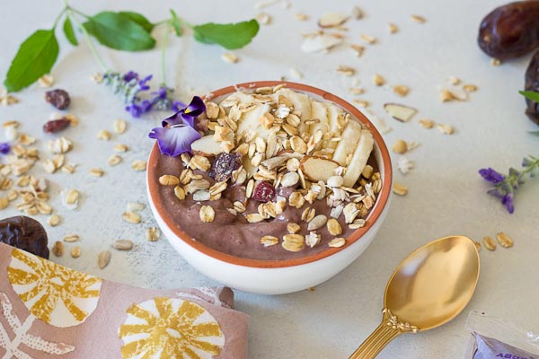 This Banana Peanut Butter Breakfast Bowl is seriously the best smoothie bowl ever. It's naturally sweetened with medjool dates, bananas and power packed with antioxidants from unsweetened acai. The creaminess factor was upped with plain kefir and peanut butter and topped with bananas (naturally) and gluten free muesli for irresistible crunch in every bite. 