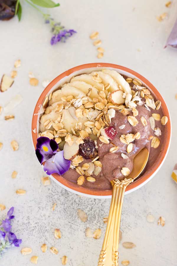 This Banana Peanut Butter Breakfast Bowl is seriously the best smoothie bowl ever. It's naturally sweetened with medjool dates, bananas and power packed with antioxidants from unsweetened acai. The creaminess factor was upped with plain kefir and peanut butter and topped with bananas (naturally) and gluten free muesli for irresistible crunch in every bite. 