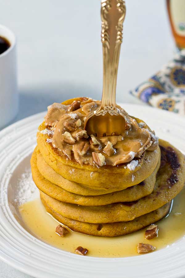 Peanut Butter Pumpkin Pancakes, need I say more? Get in my belly already! Super easy recipe made with box pancake mix to simplify your mornings. 