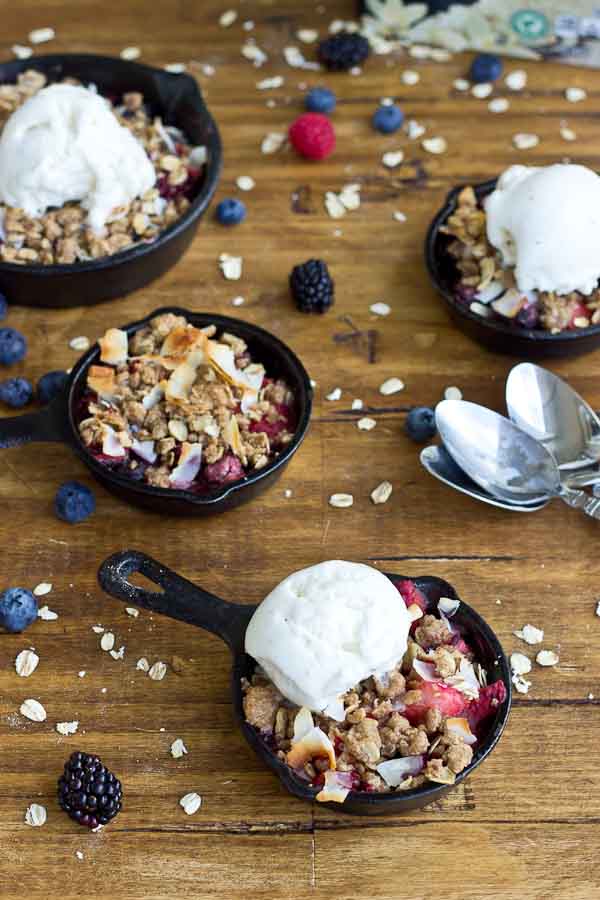 Soak up the last of summer with this Skillet Mixed Berry Oatmeal Crisp. Blueberries, raspberries, strawberries, and blackberries nestled under a warm oatmeal crisp topping and a scoop of Breyers® Natural Vanilla ice cream. So good!