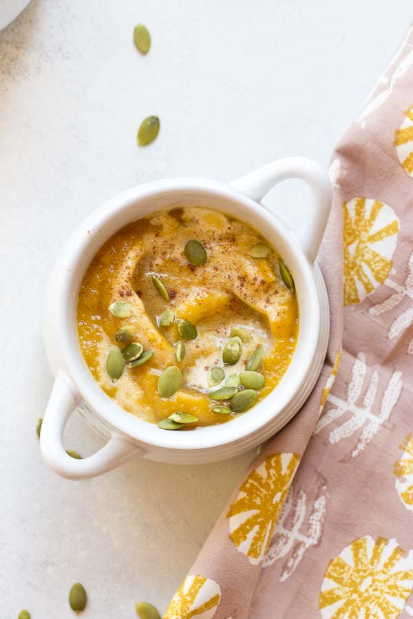 Vegan Autumn Squash Soup is a seasonal favorite and my personal health elixir. The flavors of this soup are just what you need on a chilly day. This Vegan Autumn Squash Soup made with butternut and acorn squash and honey crisp apples is oh-so-comforting and healthy!